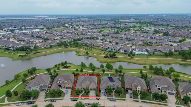birds eye view of property featuring a residential view and a water view
