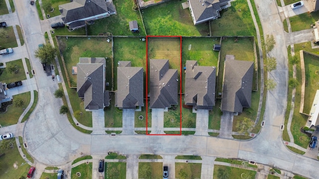 birds eye view of property with a residential view