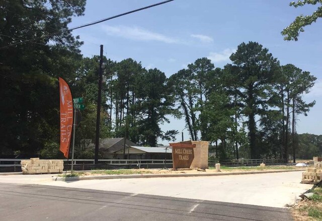 community sign with fence