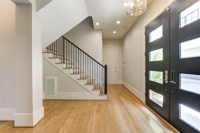 1509 Caywood Ln Unit C, Houston, TX 77055 - entrance foyer featuring stairway, wood finished floors, plenty of natural light, a chandelier, and recessed lighting