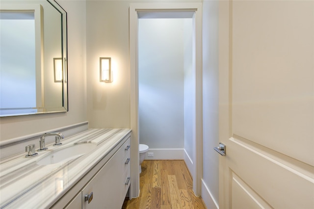 1509 Caywood Ln Unit C, Houston, TX 77055 - half bathroom with toilet, wood finished floors, vanity, and baseboards