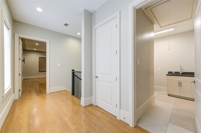 1509 Caywood Ln Unit C, Houston, TX 77055 - hallway with attic access, an upstairs landing, a sink, healthy amount of natural light, and recessed lighting