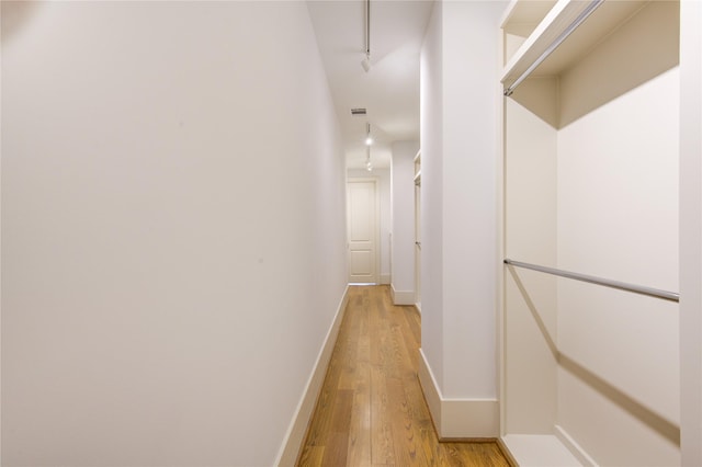 1509 Caywood Ln Unit C, Houston, TX 77055 - hallway with light wood-style flooring, baseboards, and rail lighting