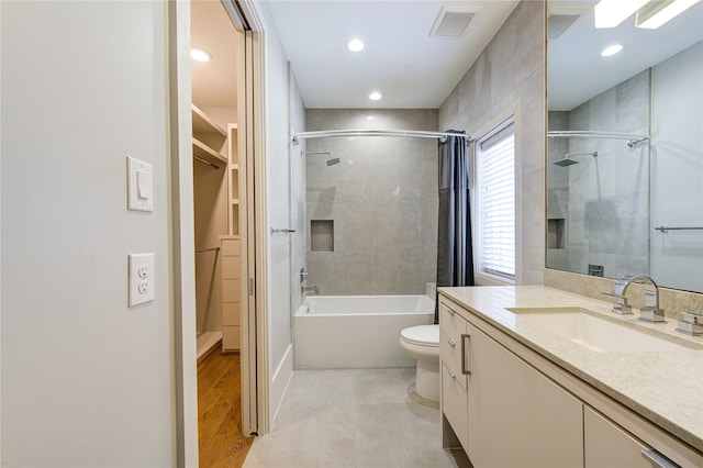 1509 Caywood Ln Unit C, Houston, TX 77055 - full bathroom with vanity, toilet, a walk in closet, shower / bathtub combination, and recessed lighting
