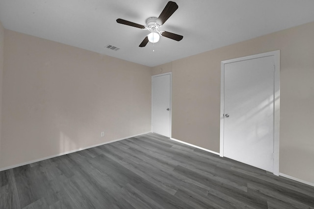 3629 Corksie St, Houston, TX 77051 - unfurnished bedroom featuring baseboards, visible vents, ceiling fan, and dark wood-style flooring