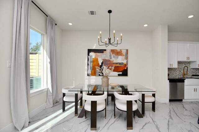 dining space with visible vents, marble finish floor, baseboards, and a notable chandelier