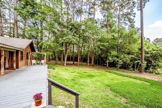 view of yard with a wooden deck