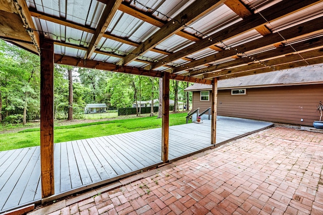 view of patio featuring fence and a wooden deck