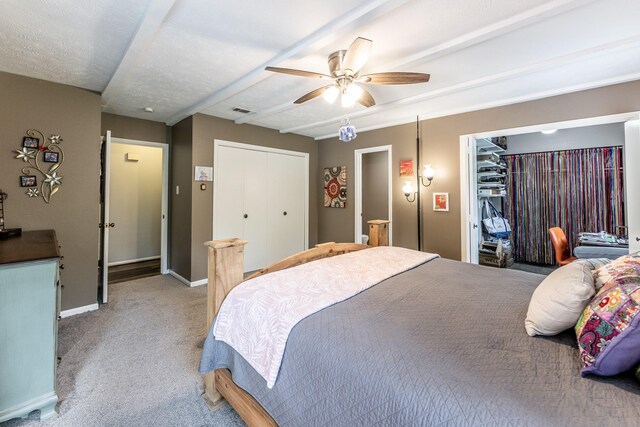 bedroom with carpet, a ceiling fan, baseboards, visible vents, and a closet
