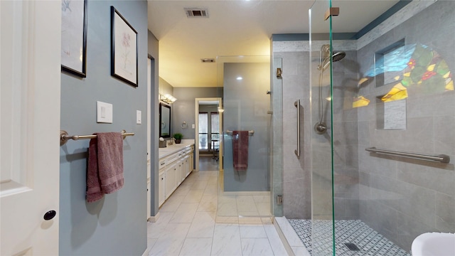 12708 Pelican Blvd, Willis, TX 77318 - bathroom with a shower stall, vanity, and marble look tile flooring