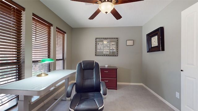 12708 Pelican Blvd, Willis, TX 77318 - home office featuring a ceiling fan, plenty of natural light, and baseboards