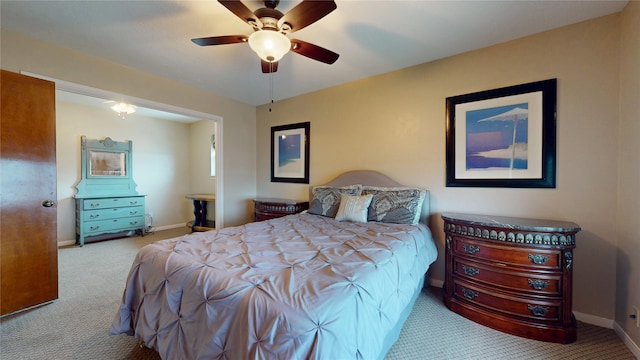 12708 Pelican Blvd, Willis, TX 77318 - carpeted bedroom with baseboards and ceiling fan