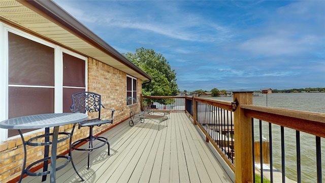 12708 Pelican Blvd, Willis, TX 77318 - wooden deck with a water view