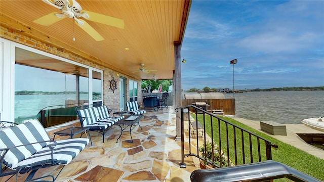 12708 Pelican Blvd, Willis, TX 77318 - view of patio / terrace featuring ceiling fan and a water view