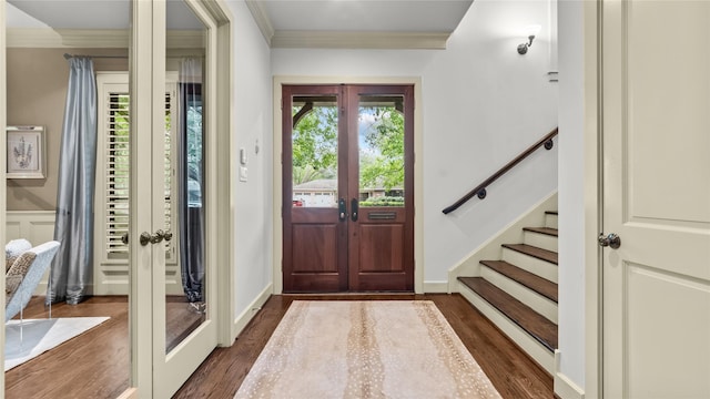 entryway with stairs, ornamental molding, french doors, and dark wood-type flooring