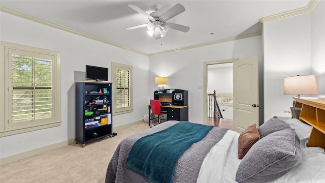 bedroom with a ceiling fan, crown molding, baseboards, and light carpet