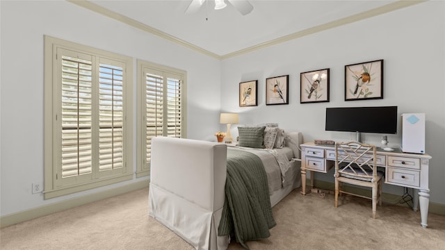 carpeted bedroom with ceiling fan and ornamental molding