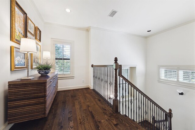 hall featuring dark wood finished floors, baseboards, recessed lighting, an upstairs landing, and ornamental molding
