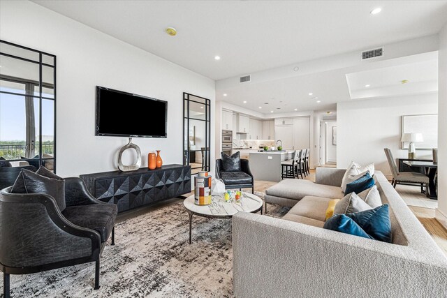 5656 San Felipe St Unit 603, Houston, TX 77056 - living area featuring recessed lighting, light wood-style floors, and visible vents