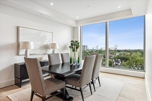 5656 San Felipe St Unit 603, Houston, TX 77056 - dining room featuring baseboards, recessed lighting, and light wood-type flooring