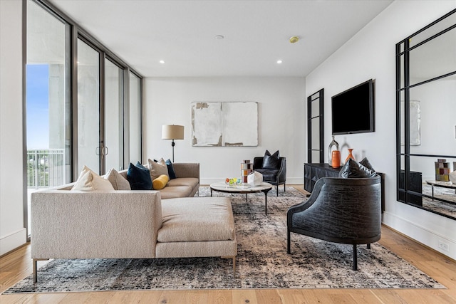 5656 San Felipe St Unit 603, Houston, TX 77056 - living area featuring recessed lighting, wood finished floors, and baseboards