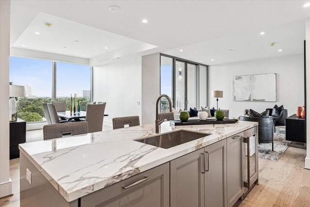 5656 San Felipe St Unit 603, Houston, TX 77056 - kitchen featuring open floor plan, gray cabinetry, a sink, and recessed lighting