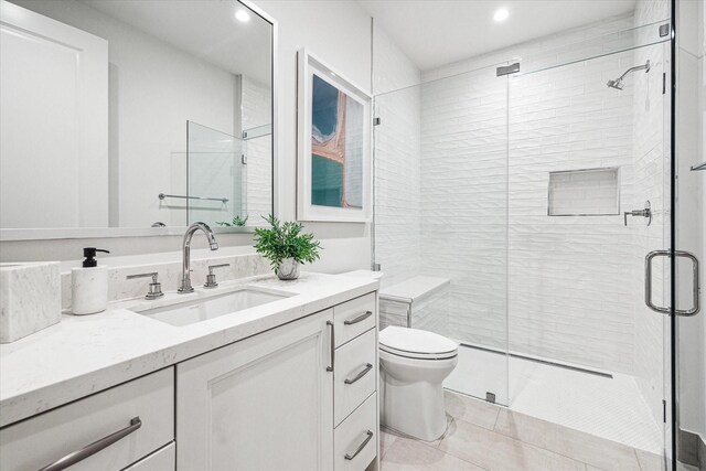 5656 San Felipe St Unit 603, Houston, TX 77056 - bathroom with recessed lighting, toilet, vanity, and a stall shower
