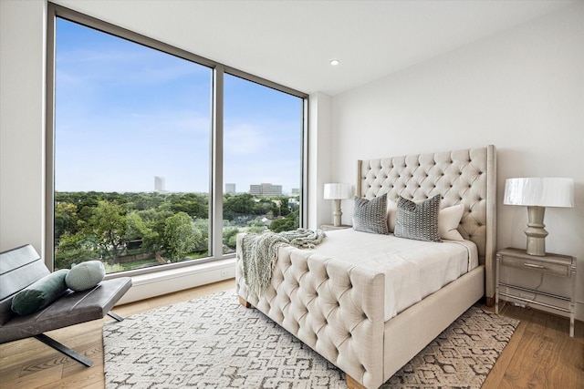 5656 San Felipe St Unit 603, Houston, TX 77056 - bedroom featuring wood finished floors and recessed lighting