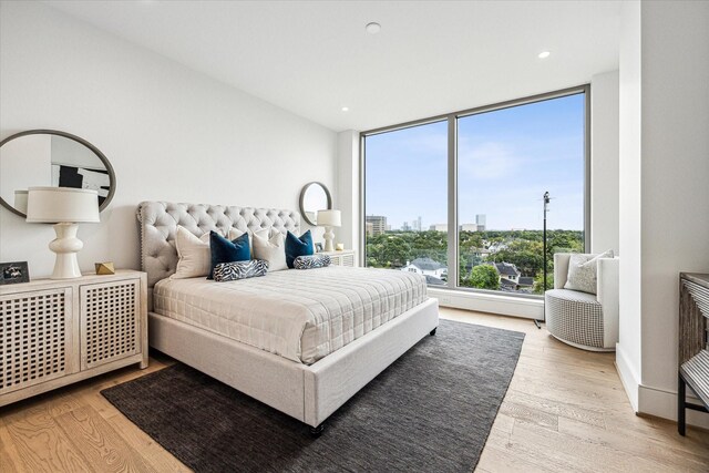 5656 San Felipe St Unit 603, Houston, TX 77056 - bedroom with recessed lighting and wood finished floors