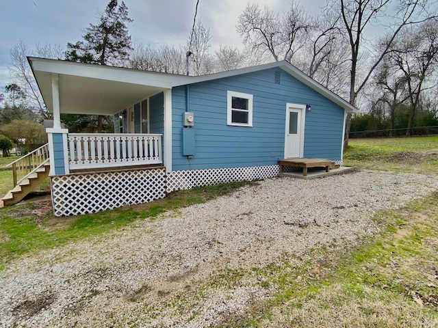 back of property featuring a porch
