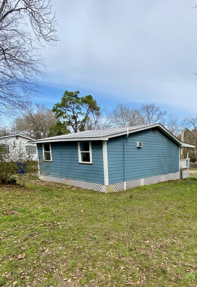 view of property exterior featuring a lawn