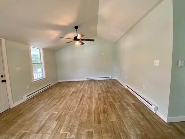 empty room with a baseboard heating unit, wood finished floors, and ceiling fan