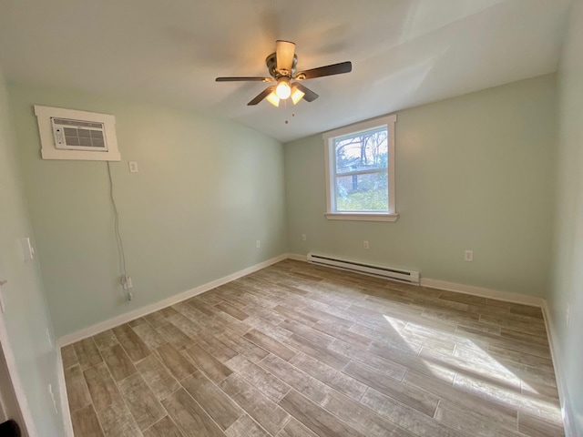 unfurnished room featuring a baseboard heating unit, wood finished floors, a ceiling fan, and baseboards