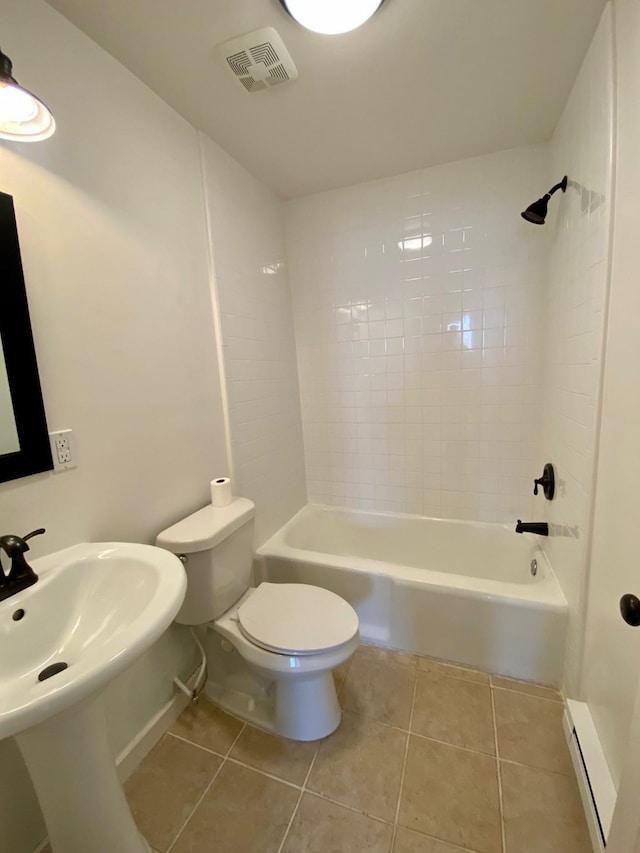 full bathroom with baseboard heating, bathtub / shower combination, toilet, tile patterned flooring, and visible vents