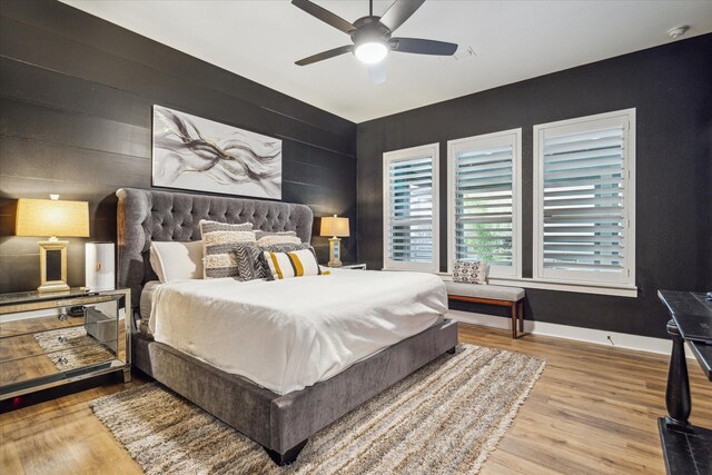 15807 Celebration Ln, Cypress, TX 77433 - bedroom with wood finished floors, baseboards, and a ceiling fan