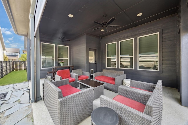 view of patio featuring an outdoor hangout area, a ceiling fan, and fence