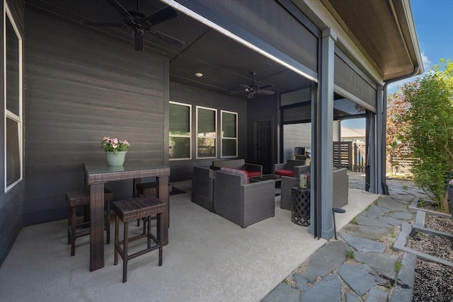 view of patio with ceiling fan, an outdoor hangout area, and outdoor dining area