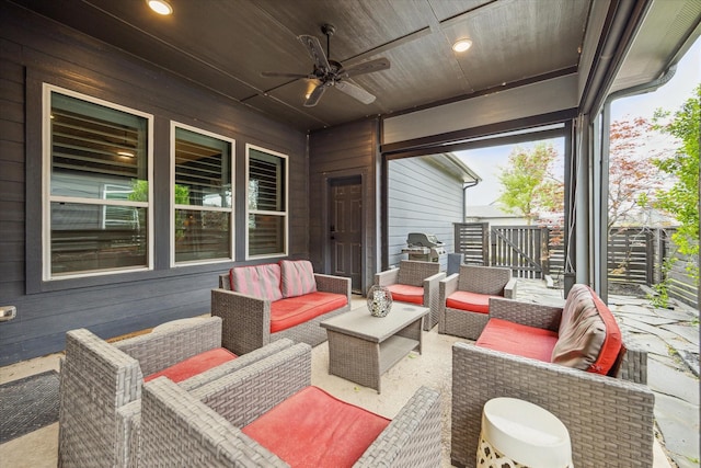 view of patio / terrace with outdoor lounge area, ceiling fan, and fence