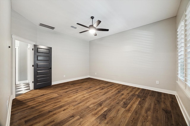 15807 Celebration Ln, Cypress, TX 77433 - empty room featuring dark wood-style floors, a ceiling fan, and baseboards