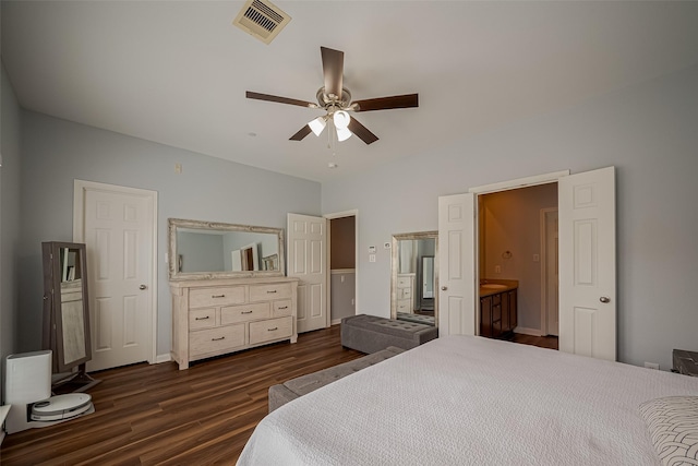 bedroom with visible vents, a ceiling fan, dark wood-style floors, and ensuite bathroom
