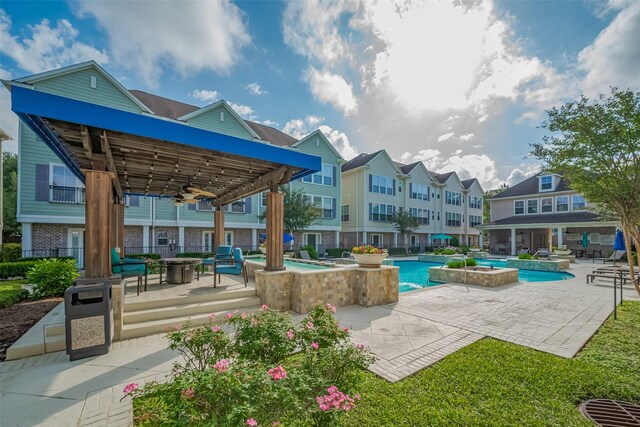 3001 Murworth Dr Unit 902, Houston, TX 77025 - community pool featuring a ceiling fan, an outdoor fire pit, an outdoor hot tub, and a patio area