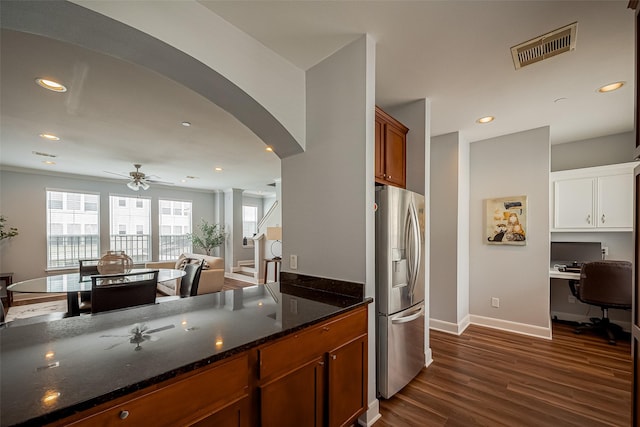 3001 Murworth Dr Unit 902, Houston, TX 77025 - kitchen featuring stainless steel fridge with ice dispenser, dark wood-style floors, arched walkways, a ceiling fan, and dark stone countertops
