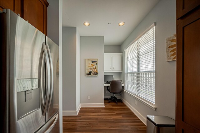 kitchen featuring white cabinets, dark wood finished floors, baseboards, recessed lighting, and stainless steel fridge with ice dispenser
