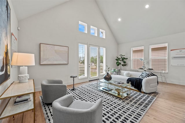 1046 Homer St, Houston, TX 77091 - living room featuring high vaulted ceiling, baseboards, wood finished floors, and recessed lighting