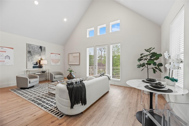 1046 Homer St, Houston, TX 77091 - living area featuring baseboards, wood finished floors, high vaulted ceiling, and recessed lighting