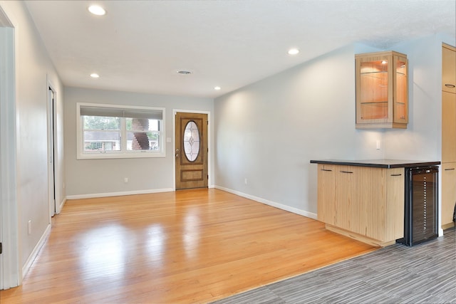 2427 Willowby Dr, Houston, TX 77008 - entrance foyer with recessed lighting, light wood finished floors, baseboards, and wine cooler