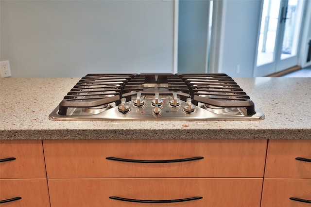 2427 Willowby Dr, Houston, TX 77008 - room details featuring stainless steel gas stovetop and light stone countertops
