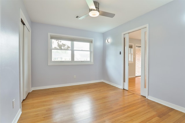 2427 Willowby Dr, Houston, TX 77008 - unfurnished bedroom featuring light wood-style flooring, baseboards, and multiple windows