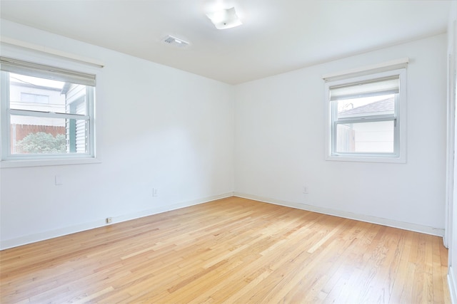 2427 Willowby Dr, Houston, TX 77008 - empty room with baseboards, visible vents, and light wood-style flooring