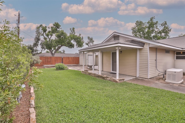 2427 Willowby Dr, Houston, TX 77008 - back of property with a lawn, fence, and a patio